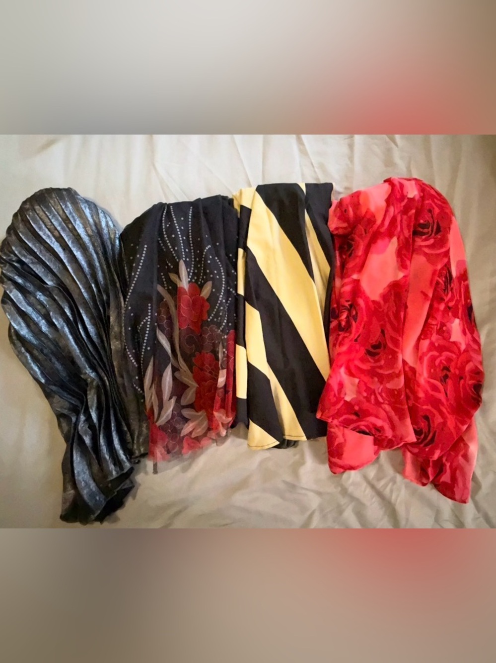 4 flowy Maxi Skirts w/various colors and designs. They fit like a women’s large